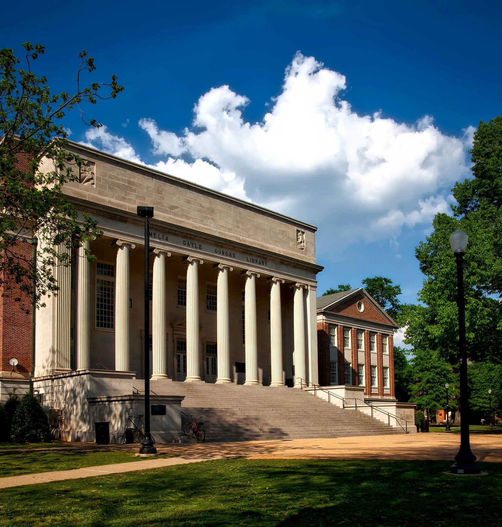 Home Historic neoclassical university library with columns on a sunny day.